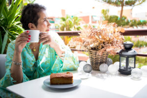 Lady drinking coffee thinking about investing 