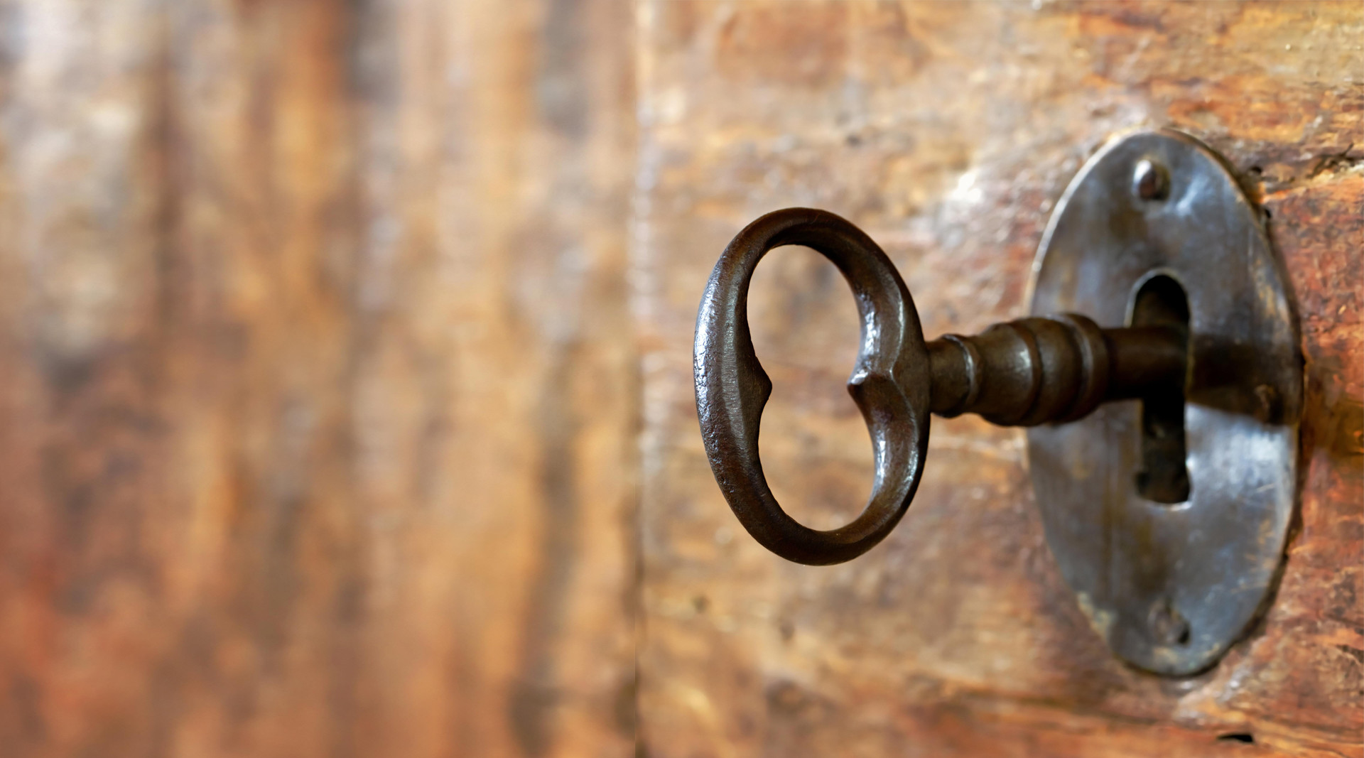 Old key in an oak door